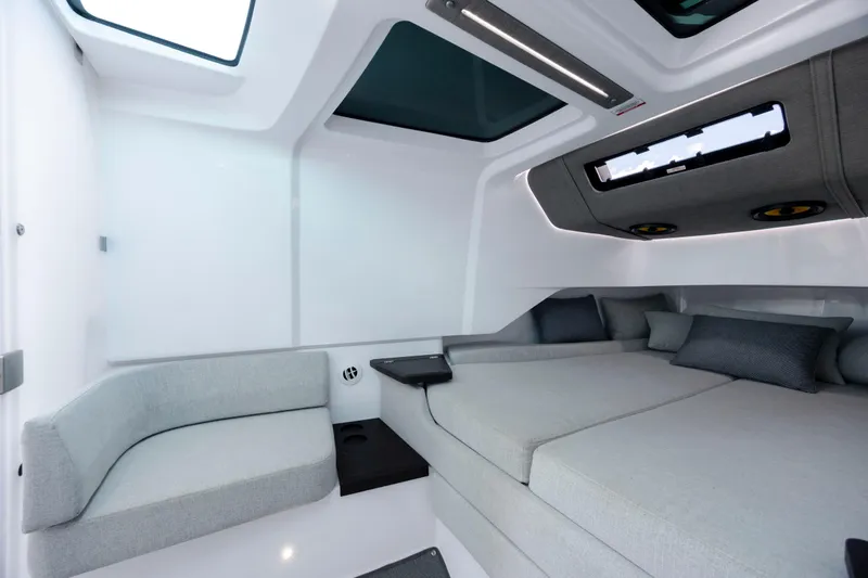 Slide: The Image of Luxurious interior of 2024 Axopar 37 XC boat with modern seating and skylights. - 64