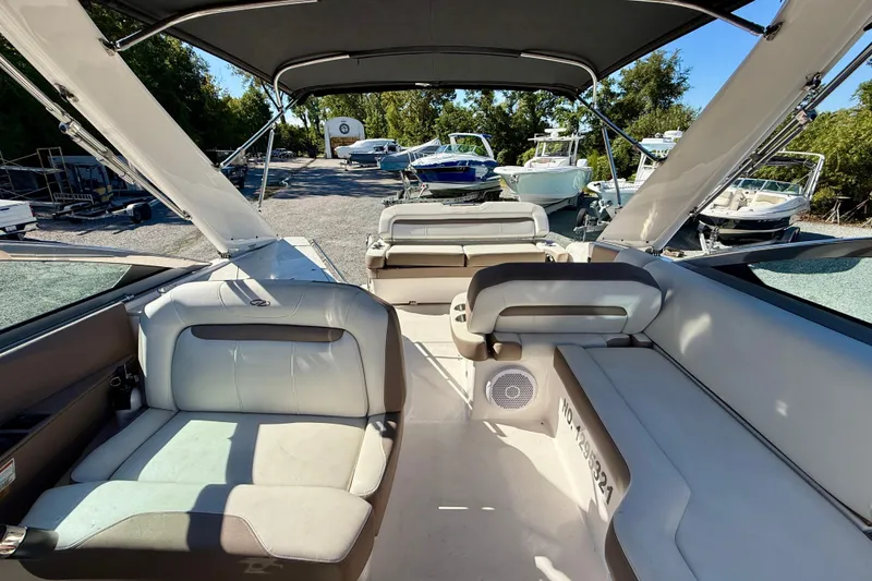 Slide: The Image of Cockpit of 2017 Regal 32 Express boat with steering wheel and navigation controls. - 17