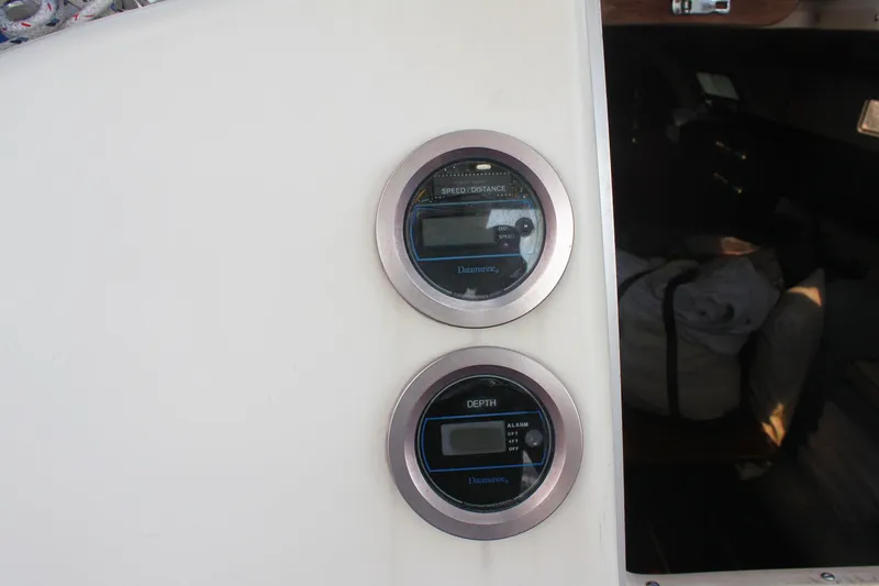 Slide: The Image of Digital speed and depth gauges on a 1988 Pearson 31 sailboat dashboard. - 20