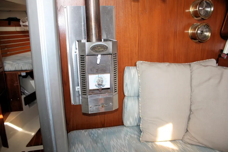 Slide: The Image of Interior of 1988 Pearson 31 sailboat with Newport heater and cozy seating area. - 40