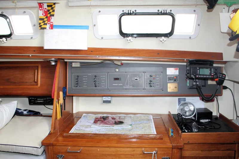 Slide: The Image of Interior of 1988 Pearson 31 sailboat with navigation station and control panel. - 44