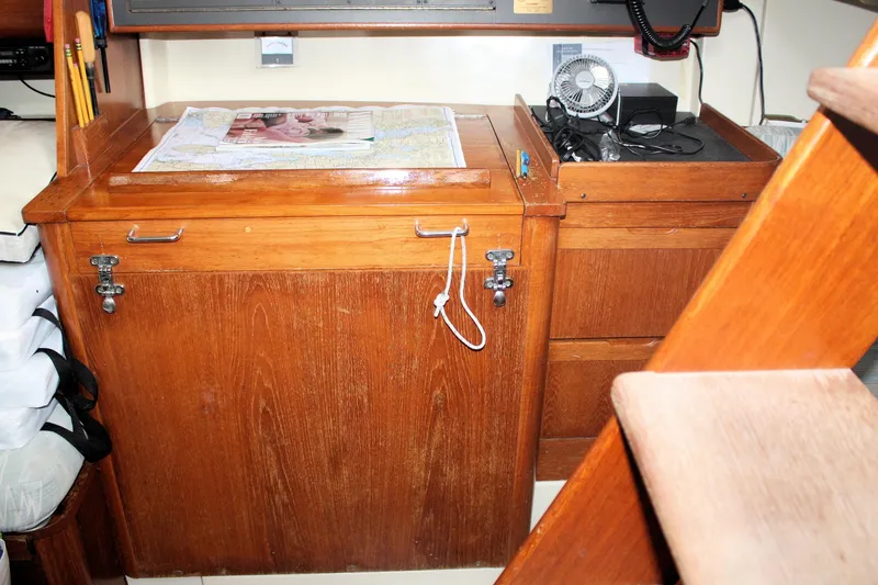 Slide: The Image of Interior of 1988 Pearson 31 sailboat with navigation station and wooden cabinetry. - 46