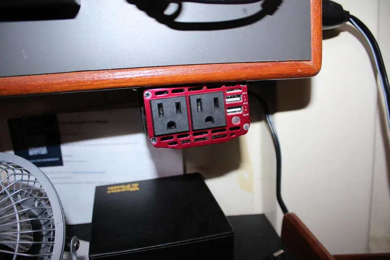 Slide: The Image of Red power outlet with USB ports on a Pearson 31, 1988 model. - 52