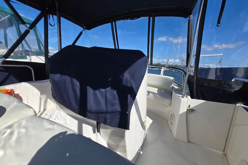 Slide: The Image of Interior view of 2002 Silverton 351 Sedan Cruiser with covered seating and clear skies. - 10