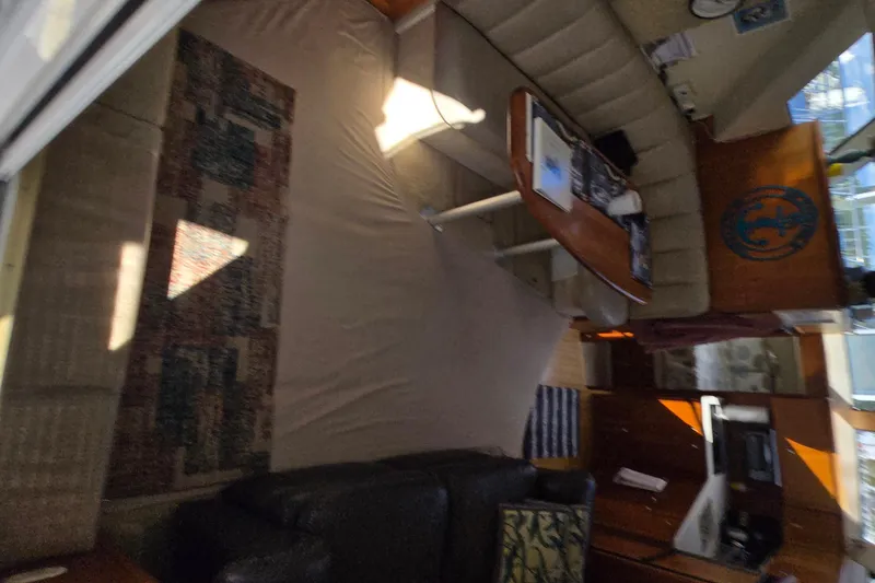 Slide: The Image of Interior of 2002 Silverton 351 Sedan Cruiser with cozy seating and wooden accents. - 21