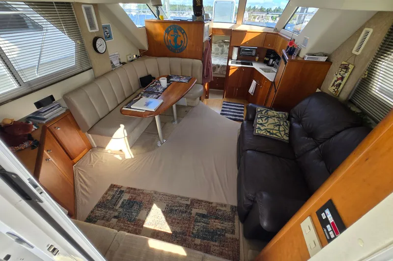 Slide: The Image of Interior of 2002 Silverton 351 Sedan Cruiser with cozy seating and kitchenette. - 22