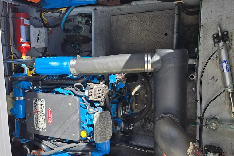 Slide: The Image of Engine compartment of a 2002 Silverton 351 Sedan Cruiser with visible components and wiring. - 27