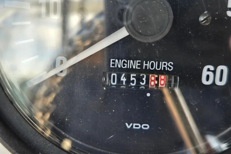Slide: The Image of Close-up of a 2002 Silverton 351 Sedan Cruiser engine hour meter showing 453.8 hours. - 34