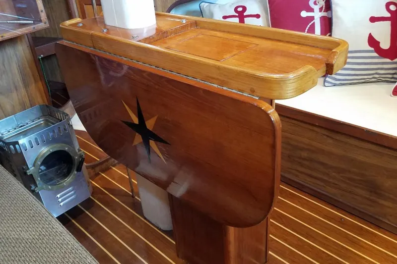 Slide: The Image of Wooden interior of 1977 Custom Bodega 30 boat with nautical decor and stove. - 17