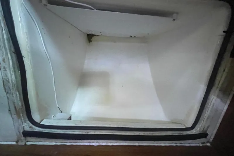 Slide: The Image of Empty interior of a vintage 1977 Custom Bodega 30 refrigerator. - 21