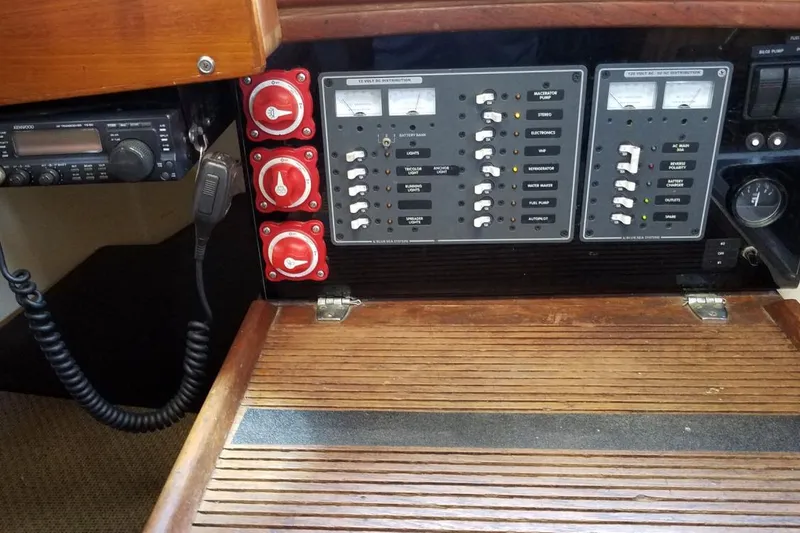 Slide: The Image of Electrical control panel on a 1977 Custom Bodega 30 boat with radio and switches. - 26