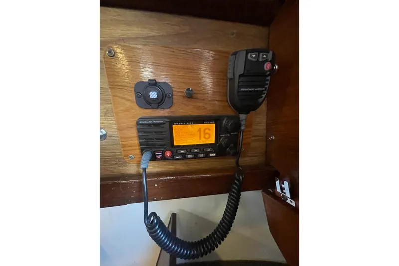 Slide: The Image of Vintage marine radio setup on 1977 Custom Bodega 30 boat, featuring Standard Horizon equipment. - 27