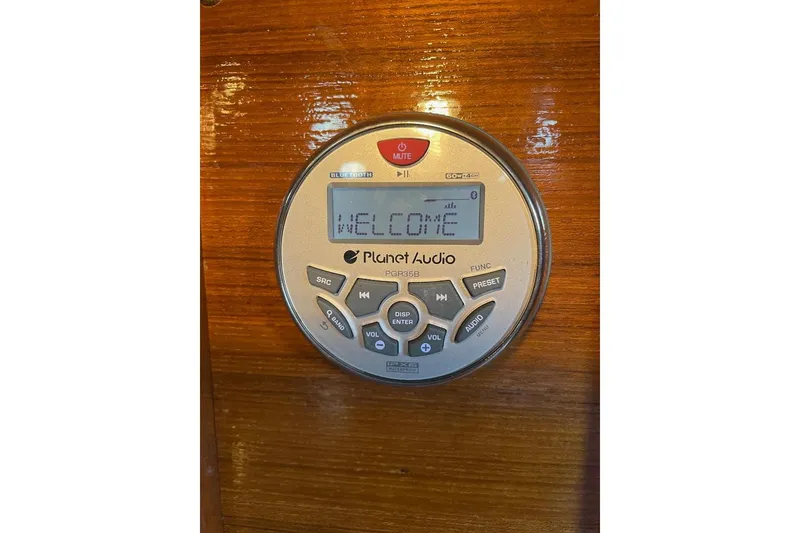 Slide: The Image of Planet Audio stereo system on Custom Bodega 30, 1977 model, displaying 'Welcome' message. - 28