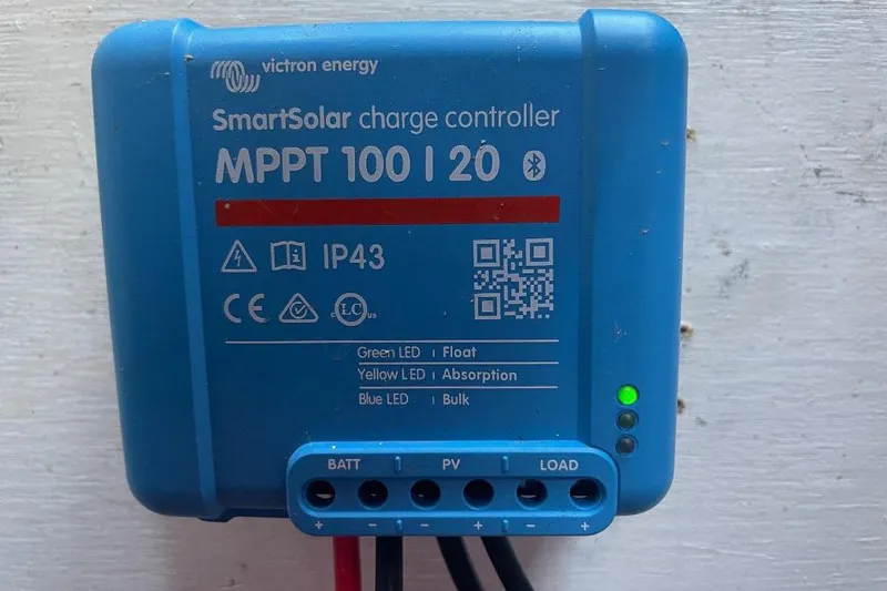 Slide: The Image of Victron Energy SmartSolar charge controller, MPPT 100/20, with LED indicators and QR code. - 30