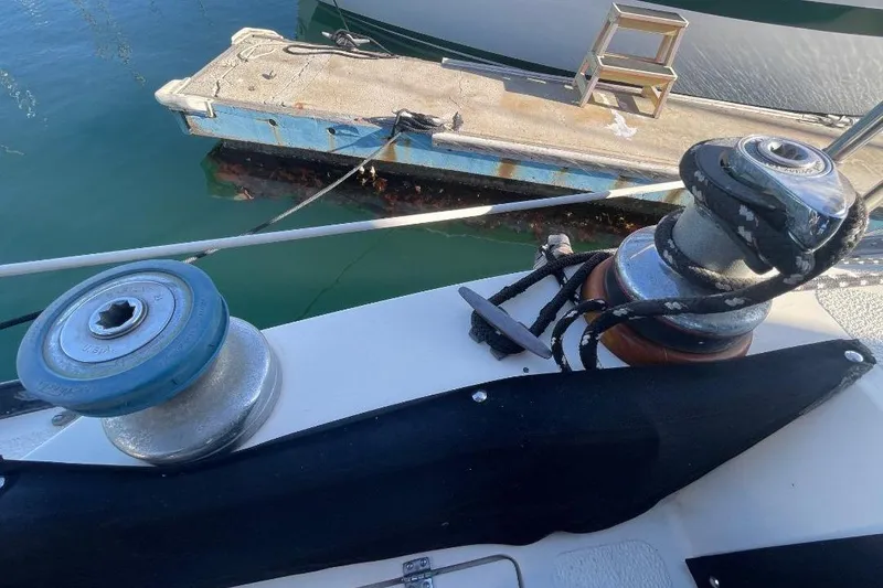 Slide: The Image of Winches on a 1977 Custom Bodega 30 sailboat near a dock. - 4