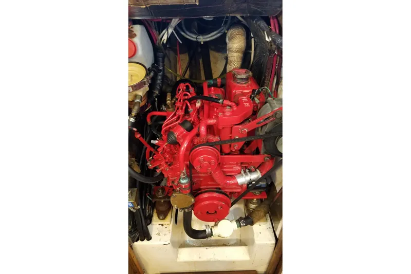 Slide: The Image of Red engine of a 1977 Custom Bodega 30 boat, detailed view. - 40