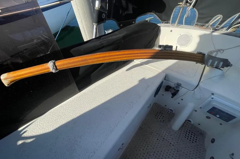 Slide: The Image of Wooden tiller on a 1977 Custom Bodega 30 sailboat, cockpit view. - 42