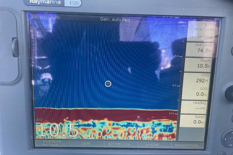 Slide: The Image of Fishfinder display on a 1977 Custom Bodega 30, showing depth and sea temperature. - 45
