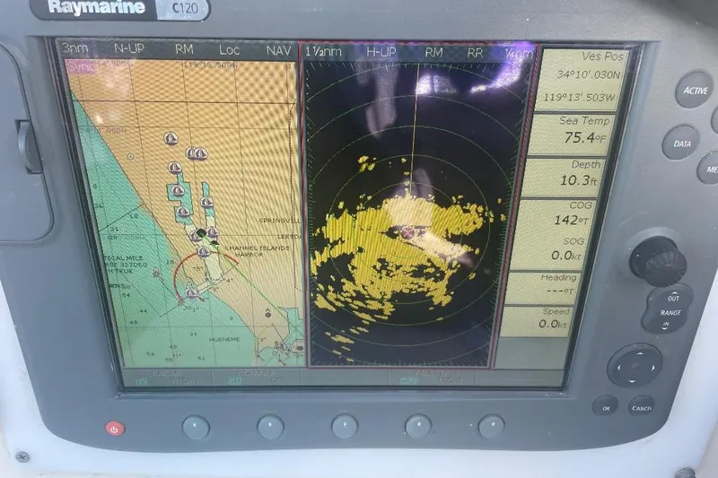 Slide: The Image of Raymarine C120 marine navigation display showing radar and chart data, Custom Bodega 30, 1977. - 46