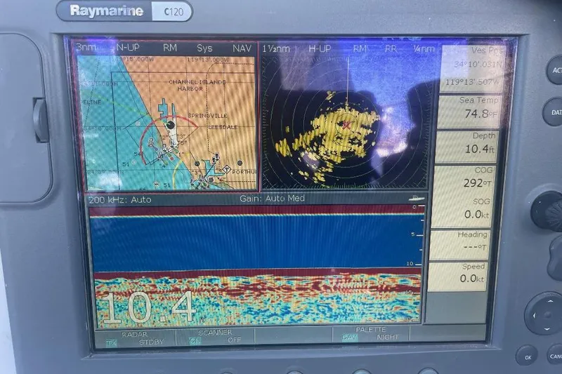 Slide: The Image of Raymarine C120 marine display showing navigation, radar, and sonar data on a Custom Bodega 30. - 47