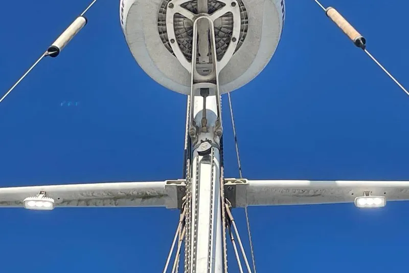 Slide: The Image of Close-up of Custom Bodega 30 sailboat mast against clear blue sky, 1977 model. - 48
