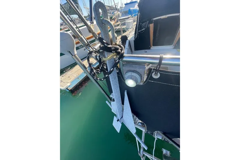 Slide: The Image of Custom Bodega 30 sailboat anchor detail, 1977 model, docked in marina. - 9
