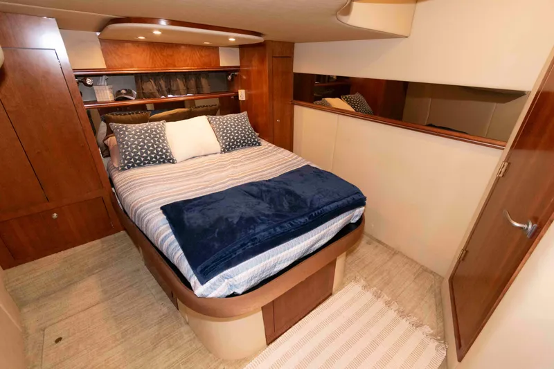 Slide: The Image of Luxurious bedroom interior of 2007 Cruisers Yachts 460 Express with cozy bedding. - 16