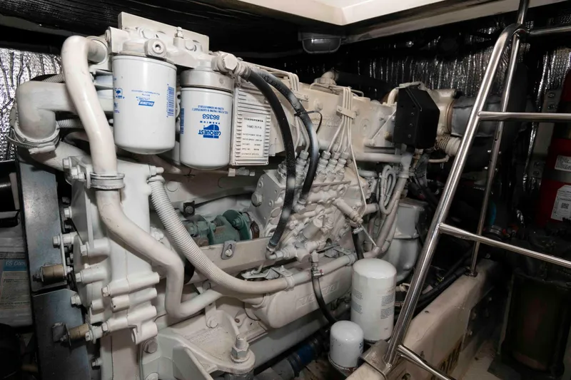 Slide: The Image of Engine room of 2007 Cruisers Yachts 460 Express, showcasing detailed machinery components. - 23