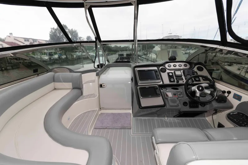Slide: The Image of 2007 Cruisers Yachts 460 Express cockpit with modern controls and spacious seating. - 3