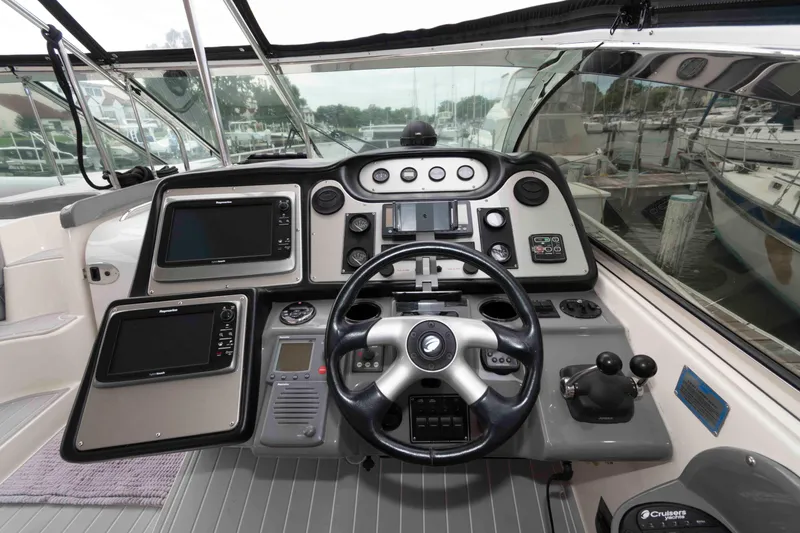 Slide: The Image of 2007 Cruisers Yachts 460 Express helm with advanced navigation and control systems. - 6