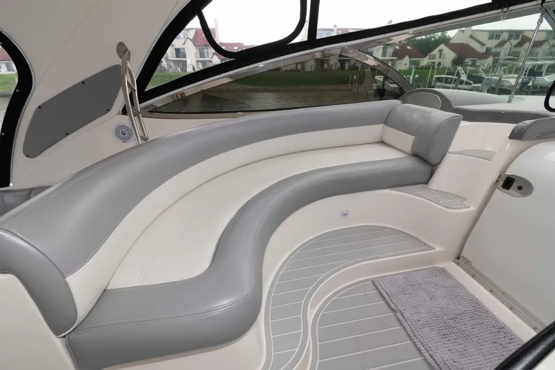 Slide: The Image of 2007 Cruisers Yachts 460 Express interior with elegant curved seating and modern design. - 7
