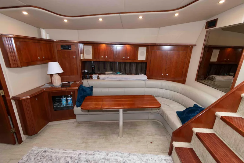 Slide: The Image of Luxurious 2007 Cruisers Yachts 460 Express interior with elegant wood cabinetry and plush seating. - 14