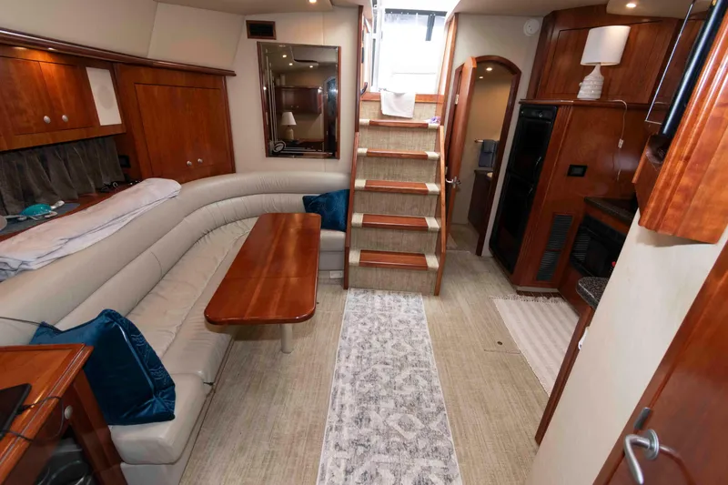 Slide: The Image of Luxurious interior of 2007 Cruisers Yachts 460 Express with elegant wood finishes and cozy seating. - 15