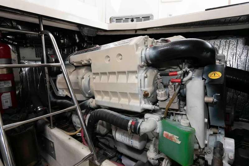 Slide: The Image of Engine room of 2007 Cruisers Yachts 460 Express, showcasing detailed mechanical components. - 24