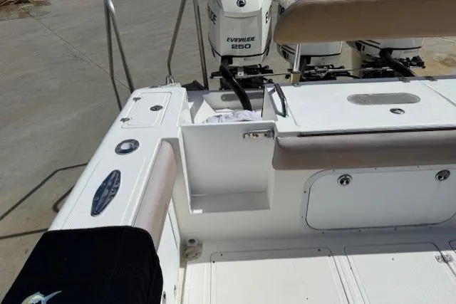 Slide: The Image of 2005 Dakota 36 CC Forward Cuddy Cabin boat deck with Evinrude 250 engines. - 14