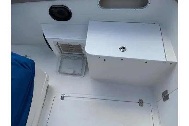 Slide: The Image of 2005 Dakota 36 CC Forward Cuddy Cabin interior with storage compartments and seating. - 21