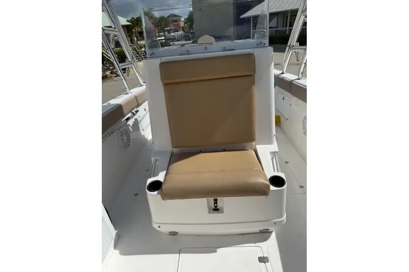 Slide: The Image of 2005 Dakota 36 CC Forward Cuddy Cabin with tan seating and cup holders. - 24