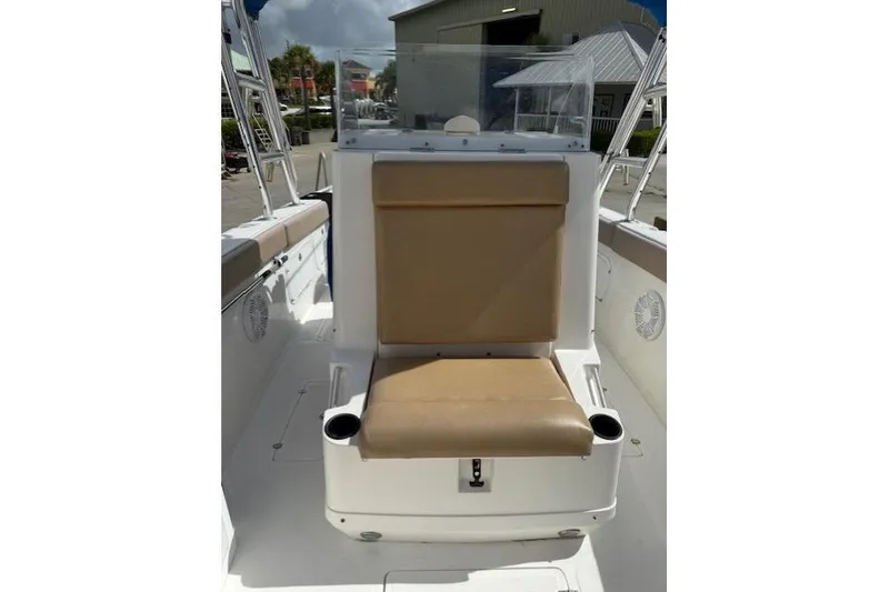 Slide: The Image of 2005 Dakota 36 CC Forward Cuddy Cabin boat interior with tan seating and cup holders. - 25