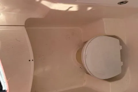 Slide: The Image of 2005 Dakota 36 CC Forward Cuddy Cabin interior with compact marine toilet. - 27