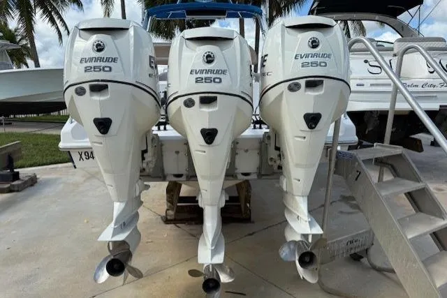 Slide: The Image of Triple Evinrude 250 outboard engines on a 2005 Dakota 36 CC Forward Cuddy Cabin boat. - 3