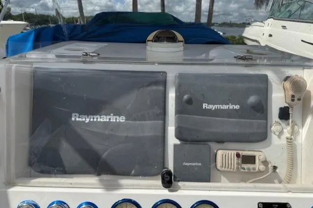 Slide: The Image of Control panel of a 2005 Dakota 36 CC Forward Cuddy Cabin with Raymarine equipment. - 6