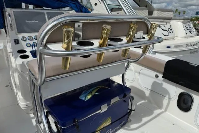 Slide: The Image of 2005 Dakota 36 CC Forward Cuddy Cabin boat interior with rod holders and cooler. - 8