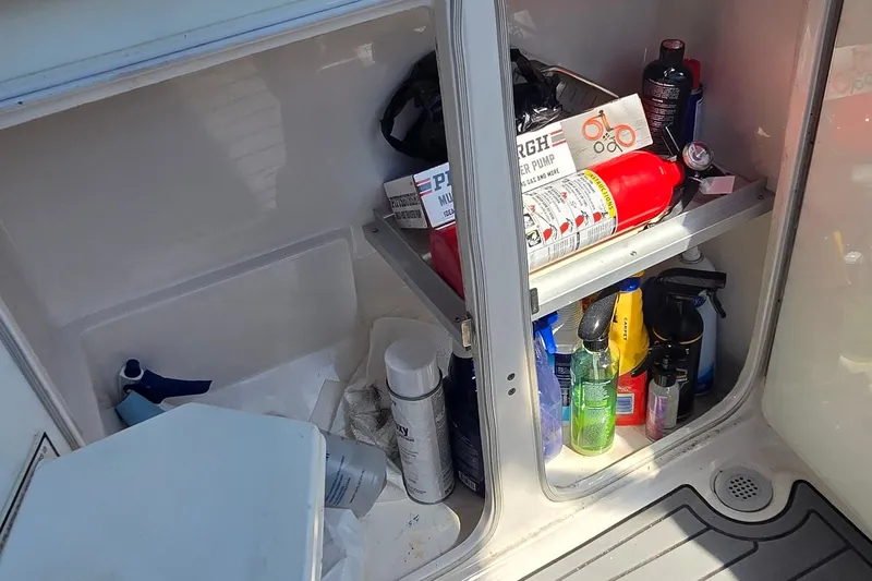 Slide: The Image of Interior of 2004 Regal Commodore 3260 yacht with cozy bed and compact kitchenette. - 17