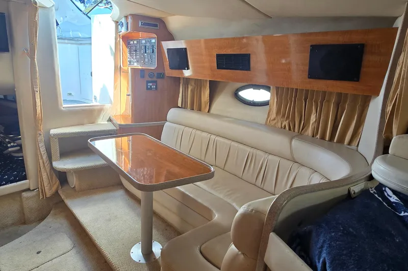 Slide: The Image of Wooden cabinet with a built-in refrigerator on a 2004 Regal Commodore 3260 boat. - 20