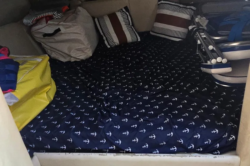 Slide: The Image of Control panel of a 2004 Regal Commodore 3260 boat, featuring various switches and gauges. - 23