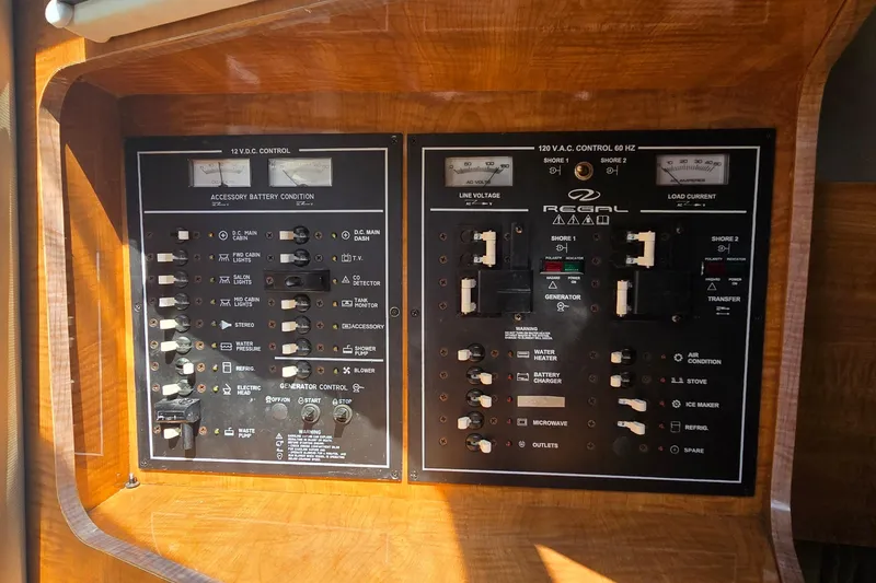Slide: The Image of Control panel of a 2004 Regal Commodore 3260 boat with JL Audio system. - 24