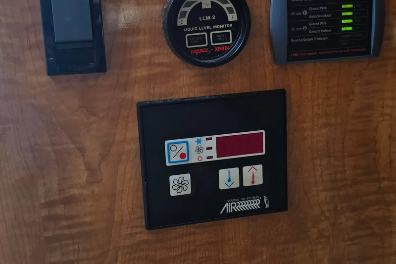 Slide: The Image of 2004 Regal Commodore 3260 bathroom with countertop and hand sanitizer bottle. - 27