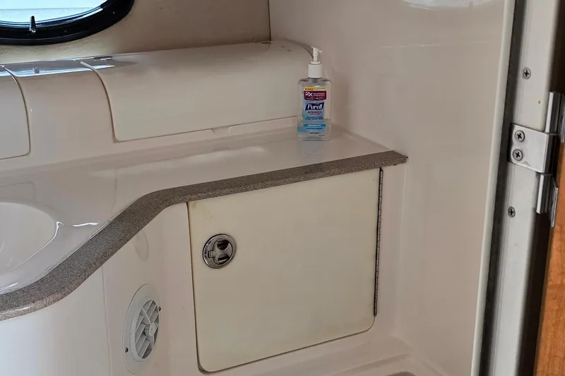 Slide: The Image of 2004 Regal Commodore 3260 boat bathroom sink with chrome faucet. - 28