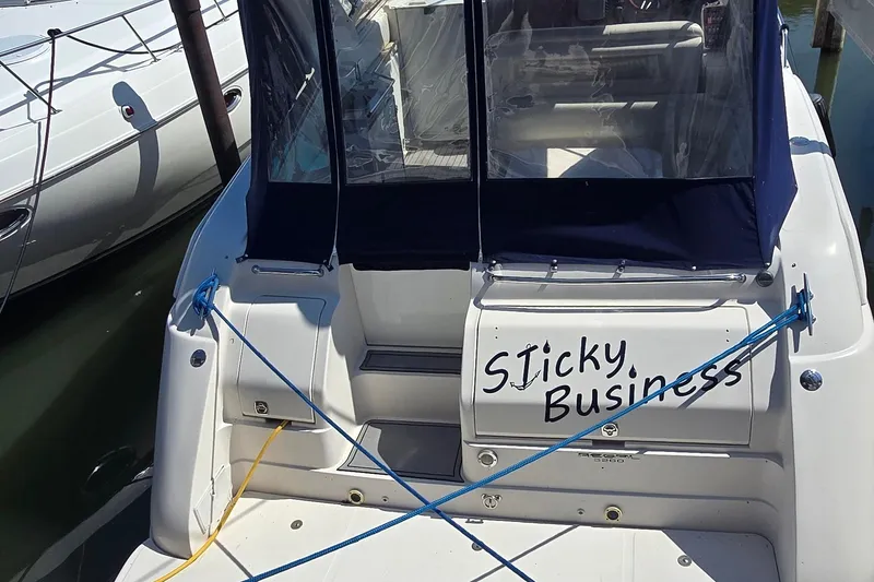 Slide: The Image of 2004 Regal Commodore 3260 boat storage compartment with blue rope and fenders inside. - 5