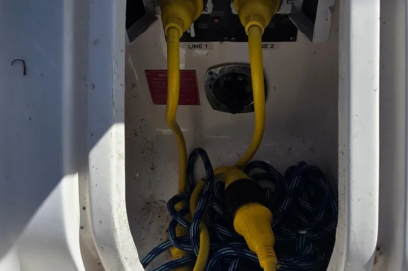 Slide: The Image of 2004 Regal Commodore 3260 boat interior with seating and table, featuring elegant design. - 7